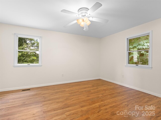 71 Auburn Park Dr, Waynesville, NC 28786 - spare room featuring light wood-type flooring and ceiling fan