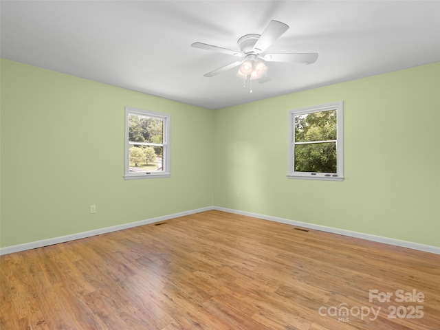 71 Auburn Park Dr, Waynesville, NC 28786 - spare room featuring plenty of natural light, light wood-style floors, and a ceiling fan