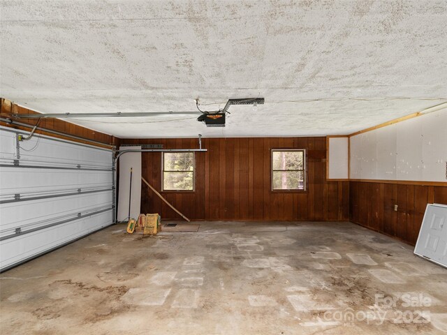 71 Auburn Park Dr, Waynesville, NC 28786 - garage with a garage door opener and wooden walls