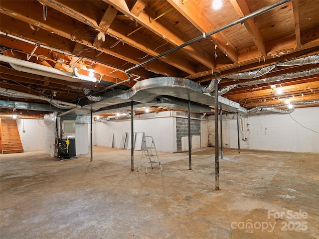 71 Auburn Park Dr, Waynesville, NC 28786 - unfinished below grade area with heating unit and stairs