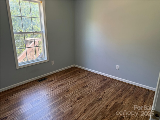 4870 Beckel Rd, Winston Salem, NC 27127 - unfurnished room with healthy amount of natural light and dark wood finished floors