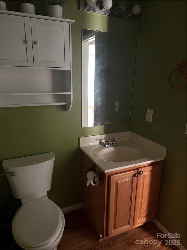 4870 Beckel Rd, Winston Salem, NC 27127 - half bathroom featuring vanity and wood finished floors