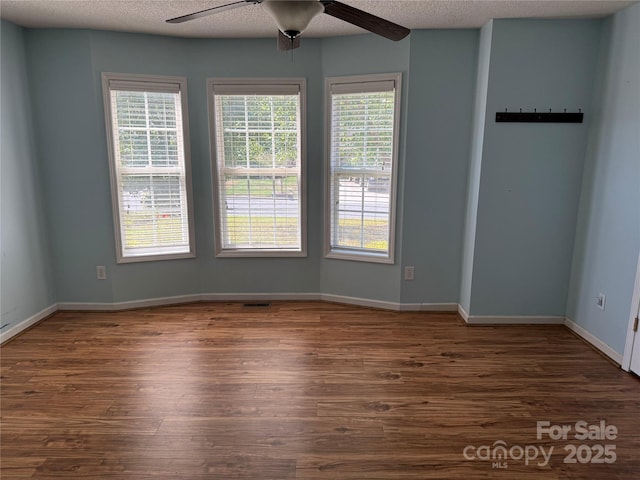 4870 Beckel Rd, Winston Salem, NC 27127 - spare room featuring ceiling fan and dark wood-style floors