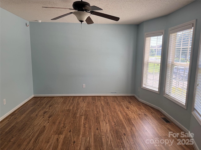 4870 Beckel Rd, Winston Salem, NC 27127 - unfurnished room featuring wood finished floors, a textured ceiling, and ceiling fan