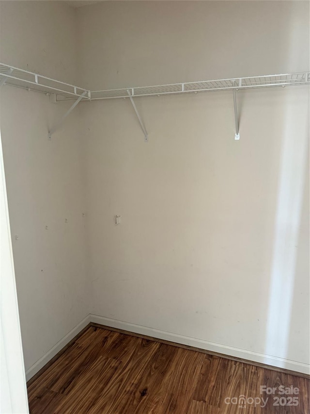 4870 Beckel Rd, Winston Salem, NC 27127 - spacious closet with dark wood-style flooring