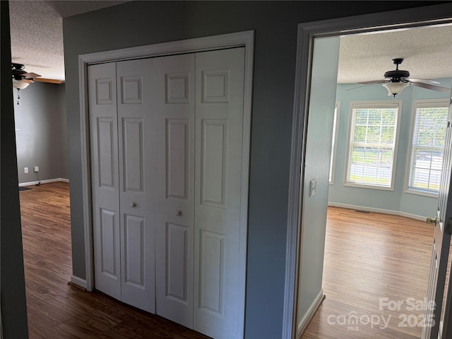 4870 Beckel Rd, Winston Salem, NC 27127 - hall with a textured ceiling and wood finished floors