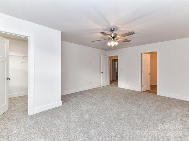 5613 Morgan Mill Rd, Monroe, NC 28110 - unfurnished bedroom featuring carpet floors, a walk in closet, a closet, and ceiling fan