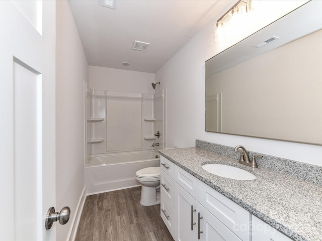5613 Morgan Mill Rd, Monroe, NC 28110 - full bathroom with vanity, wood finished floors, and shower / washtub combination