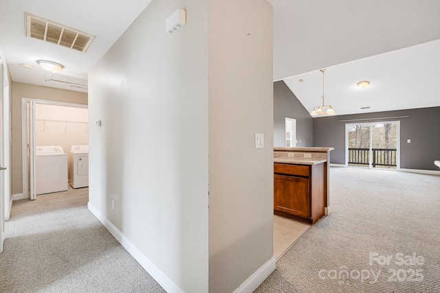 64 Foxden Dr Unit 201, Fletcher, NC 28732 - corridor featuring light carpet, independent washer and dryer, and vaulted ceiling