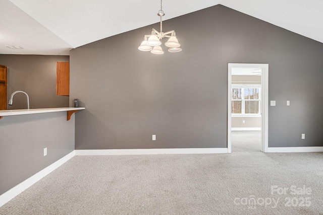 64 Foxden Dr Unit 201, Fletcher, NC 28732 - unfurnished dining area with lofted ceiling, carpet flooring, and a chandelier