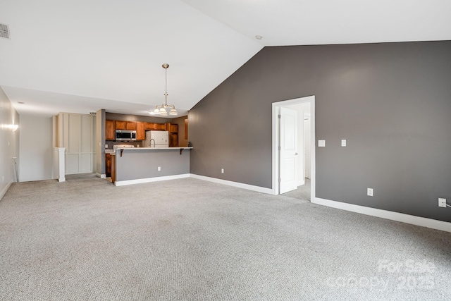 64 Foxden Dr Unit 201, Fletcher, NC 28732 - unfurnished living room with light colored carpet and high vaulted ceiling