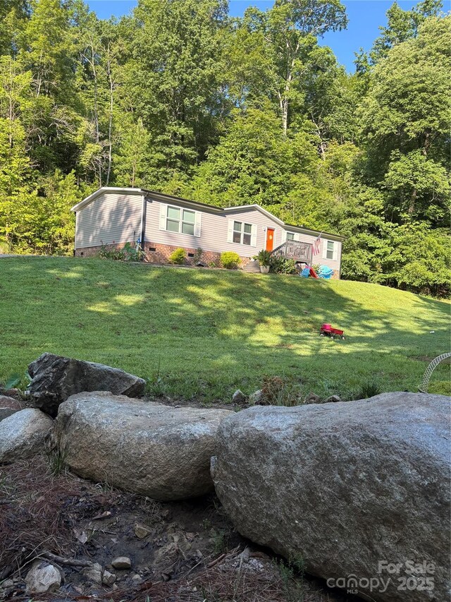 2877 Shannon St, Sharon, SC 29742 - view of green lawn featuring a forest view and a wooden deck
