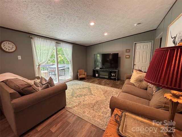 2877 Shannon St, Sharon, SC 29742 - living area with vaulted ceiling, a textured ceiling, wood finished floors, and ornamental molding
