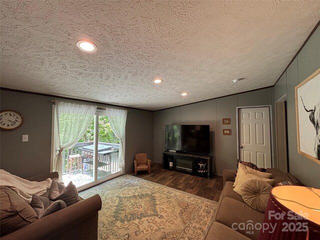 2877 Shannon St, Sharon, SC 29742 - living area featuring vaulted ceiling, a textured ceiling, wood finished floors, ornamental molding, and recessed lighting