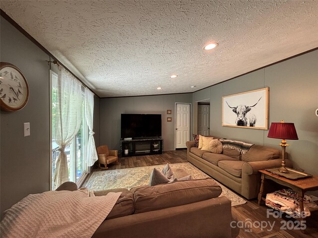 2877 Shannon St, Sharon, SC 29742 - living area with crown molding, a textured ceiling, and wood finished floors
