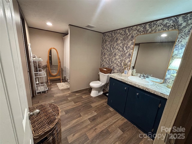 2877 Shannon St, Sharon, SC 29742 - bathroom with vanity, wallpapered walls, and wood finished floors