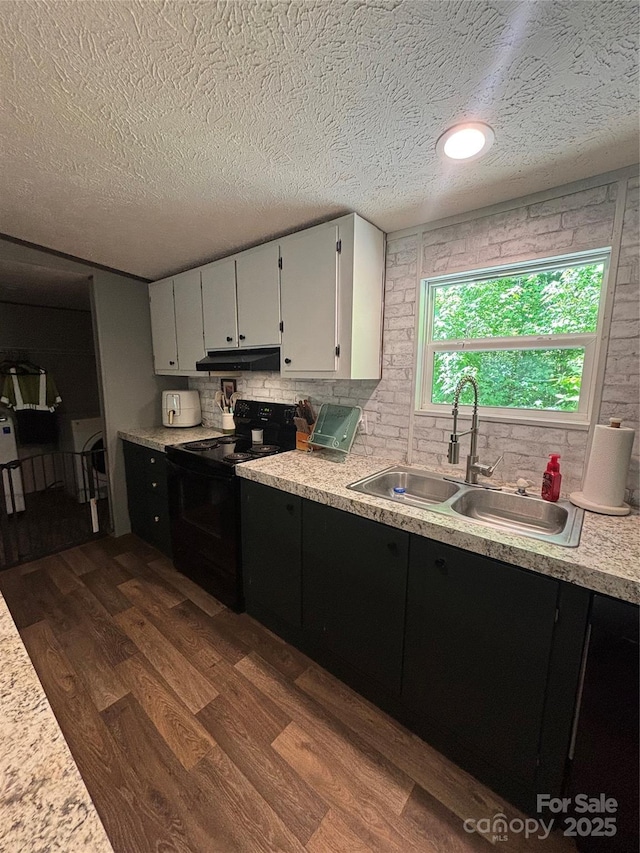 2877 Shannon St, Sharon, SC 29742 - kitchen with black / electric stove, dark wood-type flooring, light countertops, a textured ceiling, and under cabinet range hood