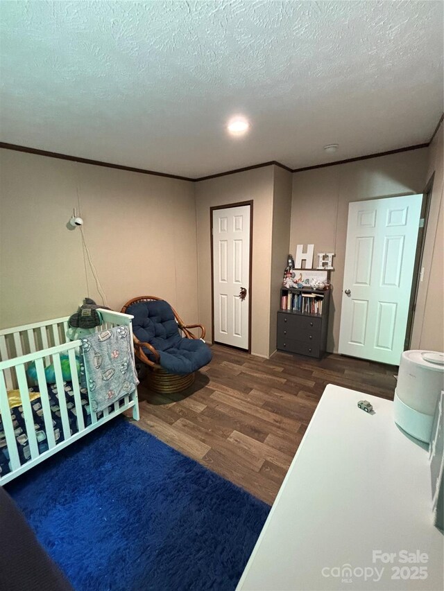 2877 Shannon St, Sharon, SC 29742 - bedroom featuring wood finished floors, ornamental molding, and a textured ceiling