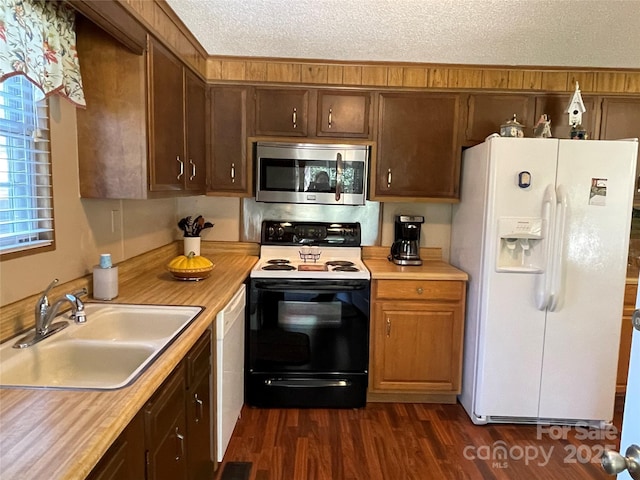 3403 Beaty Rd, Gastonia, NC 28056 - kitchen with white appliances, light countertops, and dark wood-style flooring