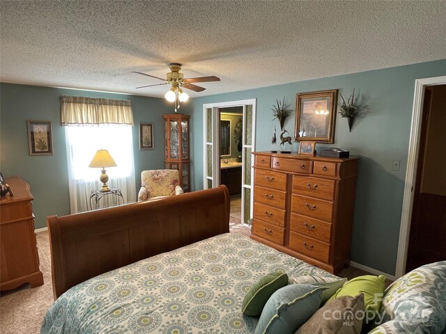 3403 Beaty Rd, Gastonia, NC 28056 - carpeted bedroom featuring a textured ceiling, ensuite bath, and a ceiling fan