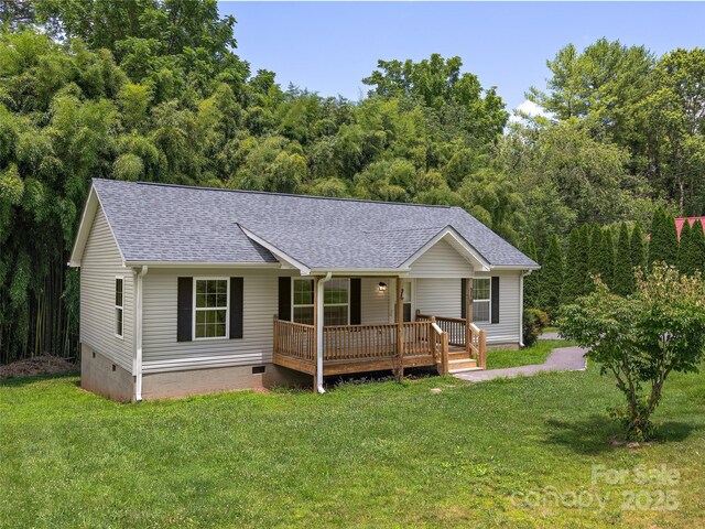 19 Cedar St, Canton, NC 28716 - single story home with crawl space, roof with shingles, a porch, a front lawn, and a forest view