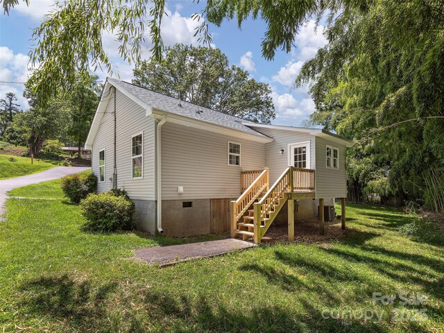 19 Cedar St, Canton, NC 28716 - back of property with a lawn, stairs, roof with shingles, and crawl space