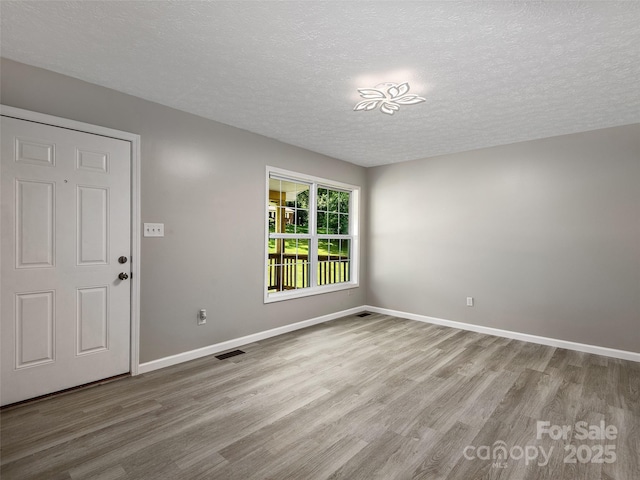 19 Cedar St, Canton, NC 28716 - foyer with wood finished floors and a textured ceiling