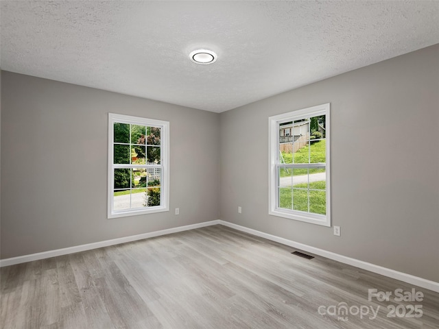 19 Cedar St, Canton, NC 28716 - unfurnished room featuring wood finished floors and a textured ceiling