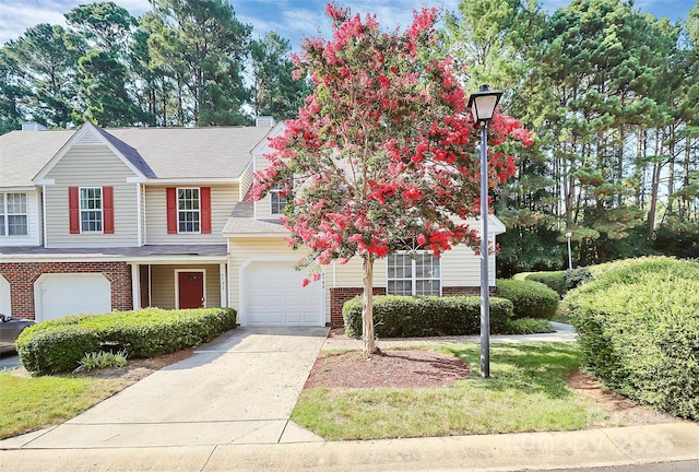 4580 Antelope Ln, Charlotte, NC 28269 - view of property featuring brick siding, driveway, and a garage