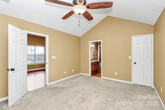 4580 Antelope Ln, Charlotte, NC 28269 - unfurnished bedroom with lofted ceiling, light carpet, ensuite bath, and ceiling fan