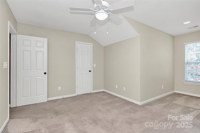 4580 Antelope Ln, Charlotte, NC 28269 - unfurnished bedroom featuring carpet, a ceiling fan, and lofted ceiling