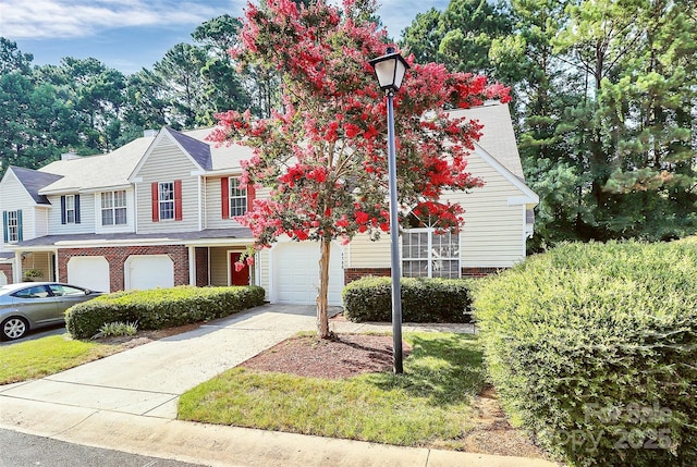 4580 Antelope Ln, Charlotte, NC 28269 - multi unit property with an attached garage, brick siding, and driveway