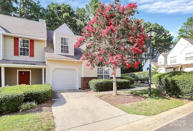 4580 Antelope Ln, Charlotte, NC 28269 - view of front of house with driveway, roof with shingles, and an attached garage