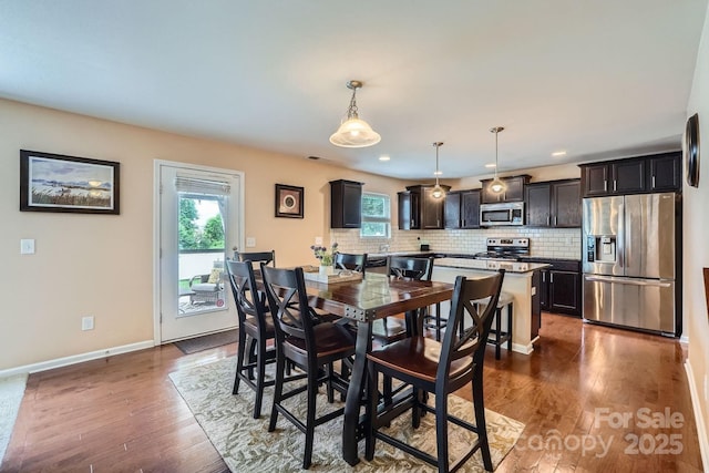 10920 Dapple Grey Ln, Charlotte, NC 28213 - dining room with dark wood finished floors and recessed lighting