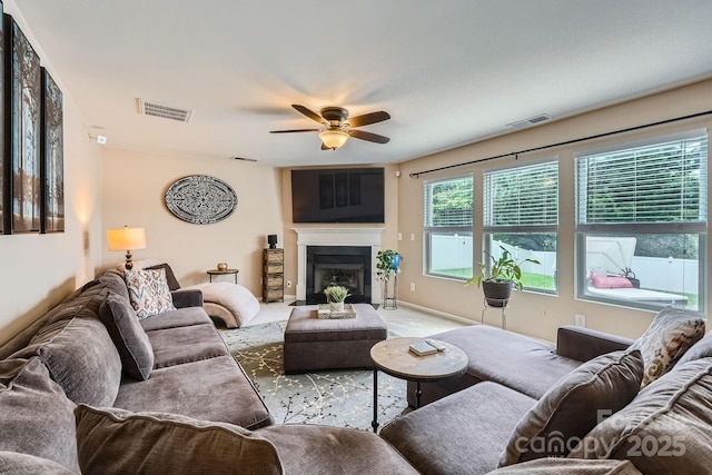 10920 Dapple Grey Ln, Charlotte, NC 28213 - living area featuring a ceiling fan, a glass covered fireplace, and light colored carpet