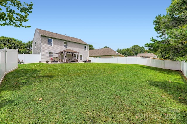 10920 Dapple Grey Ln, Charlotte, NC 28213 - back of house featuring a gazebo, a patio, and a fenced backyard