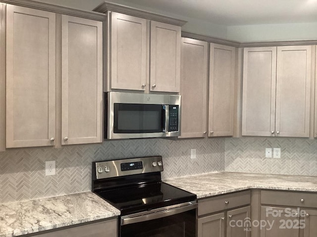 5126 Rocky River Crossing Rd, Harrisburg, NC 28075 - kitchen with stainless steel appliances, gray cabinets, backsplash, and light stone countertops