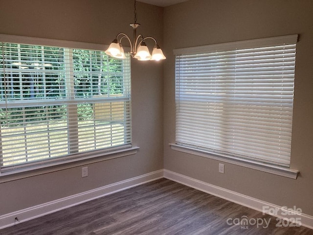 5126 Rocky River Crossing Rd, Harrisburg, NC 28075 - spare room with a chandelier and dark wood finished floors