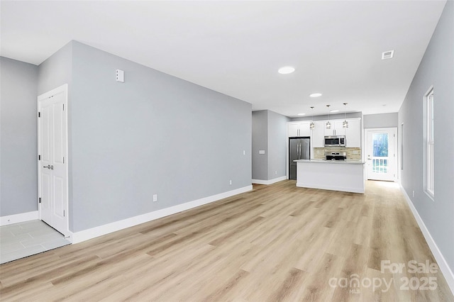 226 N Columbia Ave, Rock Hill, SC 29730 - unfurnished living room featuring light wood-type flooring and recessed lighting