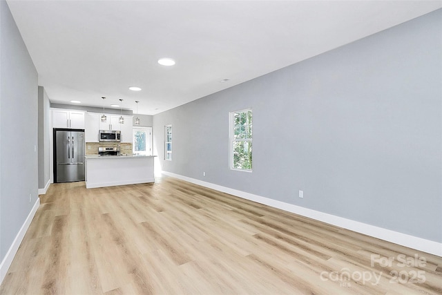226 N Columbia Ave, Rock Hill, SC 29730 - unfurnished living room featuring recessed lighting and light wood-style flooring