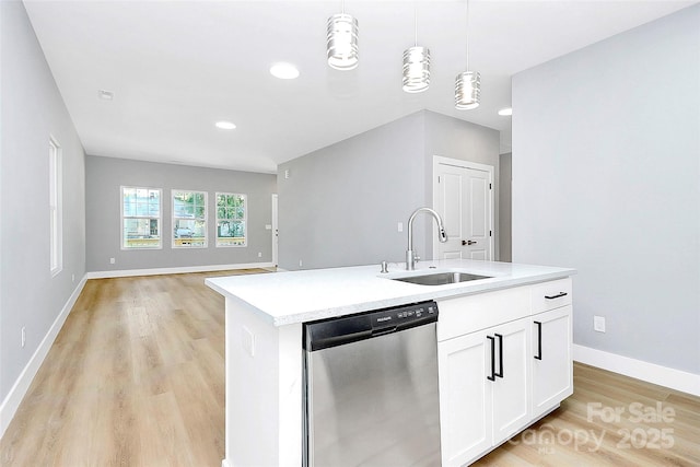 226 N Columbia Ave, Rock Hill, SC 29730 - kitchen featuring stainless steel dishwasher, light countertops, light wood-style flooring, pendant lighting, and open floor plan