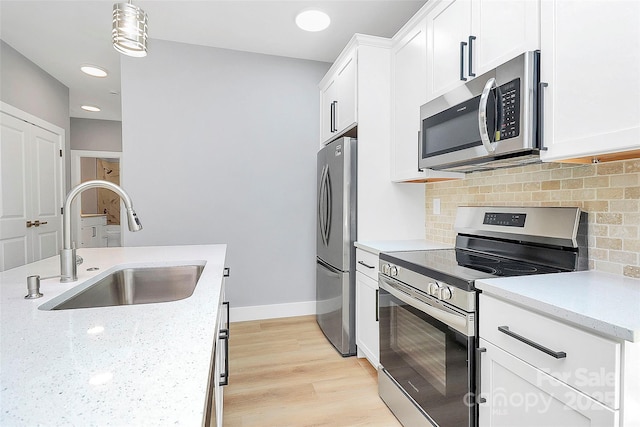 226 N Columbia Ave, Rock Hill, SC 29730 - kitchen with stainless steel appliances, backsplash, white cabinets, light stone countertops, and recessed lighting