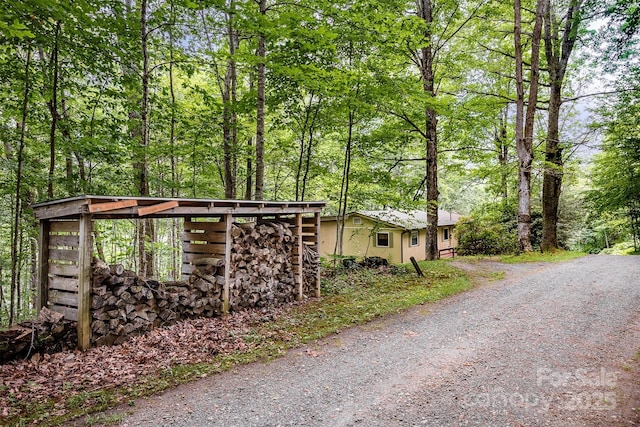 821 Old Chestnut Mountain Rd, Newland, NC 28645 - view of side of property featuring a wooded view and stone siding