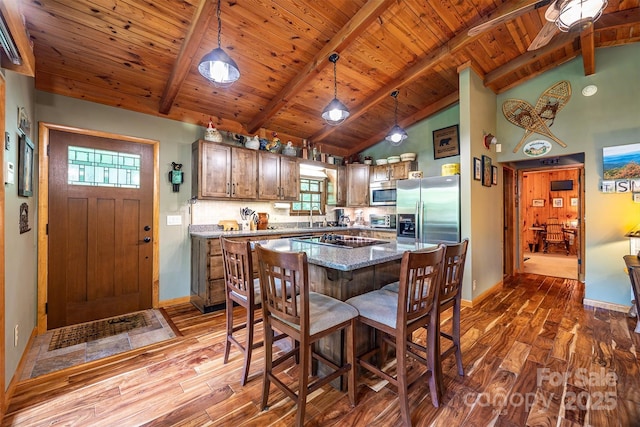821 Old Chestnut Mountain Rd, Newland, NC 28645 - kitchen with stainless steel appliances, dark wood-style floors, a wooden ceiling with exposed beams, hanging light fixtures, and high vaulted ceiling