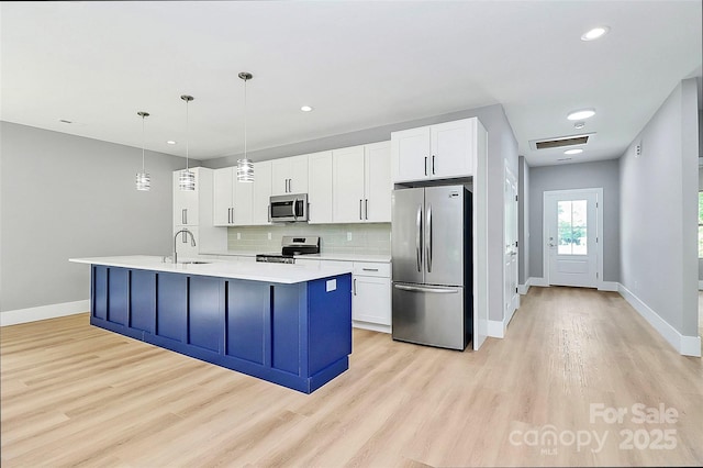 5516 Old York Rd, Rock Hill, SC 29732 - kitchen with stainless steel appliances, light wood-style flooring, light countertops, tasteful backsplash, and recessed lighting