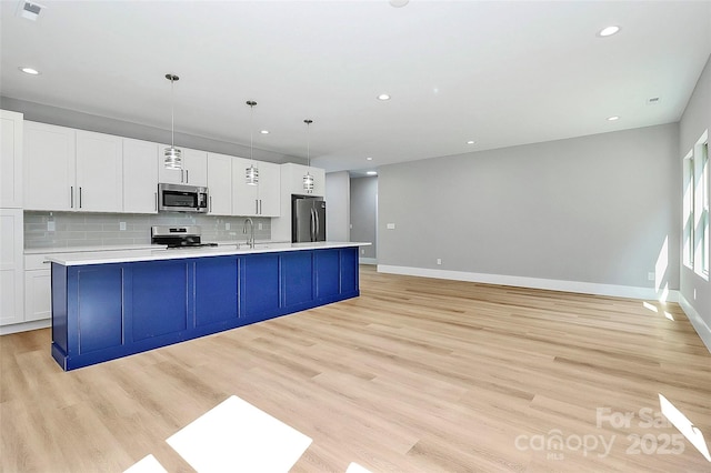 5516 Old York Rd, Rock Hill, SC 29732 - kitchen with appliances with stainless steel finishes, a spacious island, light countertops, recessed lighting, and decorative backsplash