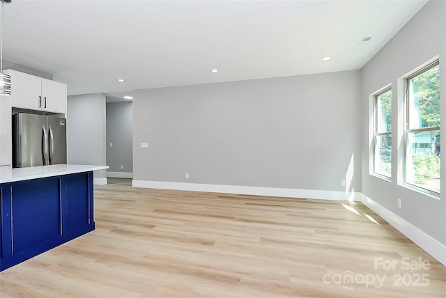 5516 Old York Rd, Rock Hill, SC 29732 - kitchen featuring freestanding refrigerator, light wood-style floors, light countertops, white cabinets, and recessed lighting
