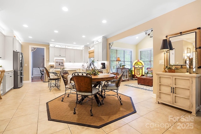 15933 Glen Miro Dr, Huntersville, NC 28078 - dining area with light tile patterned flooring, crown molding, recessed lighting, and lofted ceiling