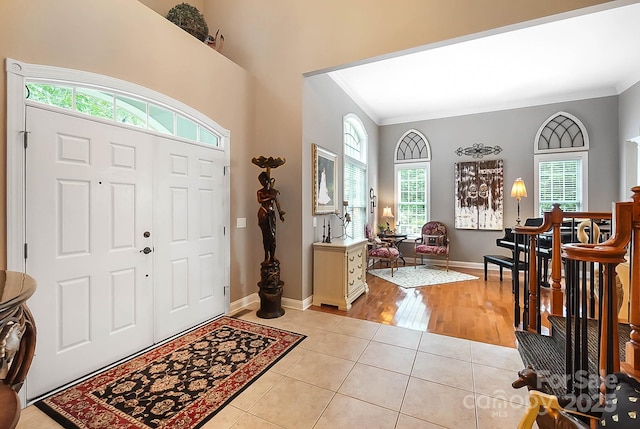 15933 Glen Miro Dr, Huntersville, NC 28078 - entryway featuring crown molding, plenty of natural light, and light tile patterned flooring