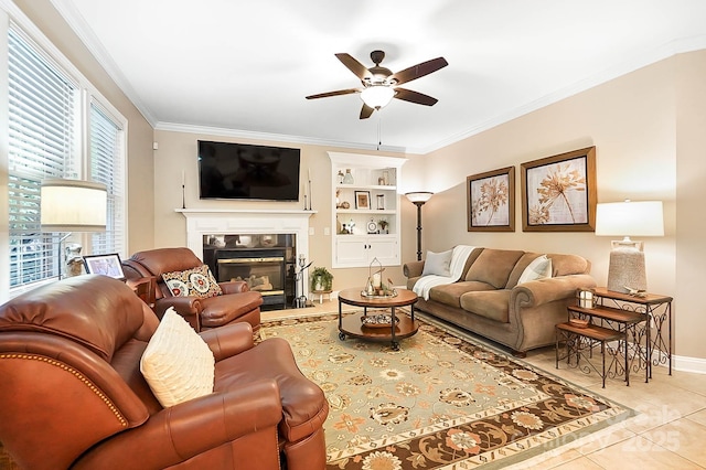 15933 Glen Miro Dr, Huntersville, NC 28078 - living room featuring a ceiling fan, crown molding, a tile fireplace, light tile patterned floors, and built in features
